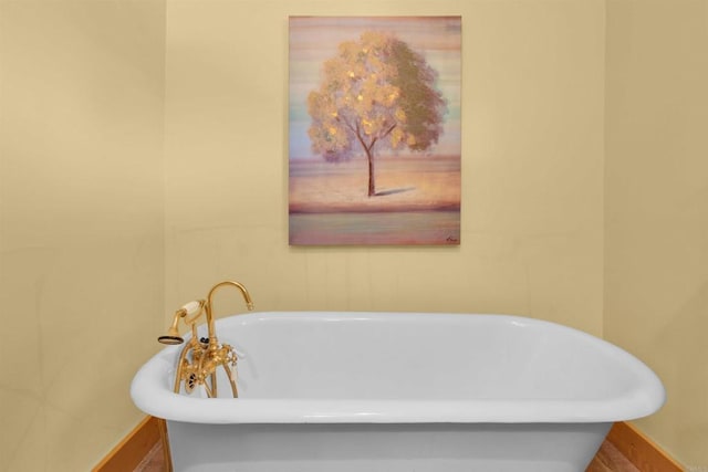 bathroom with a tub to relax in