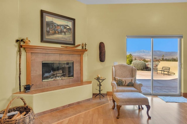 sitting room featuring a fireplace and light hardwood / wood-style floors