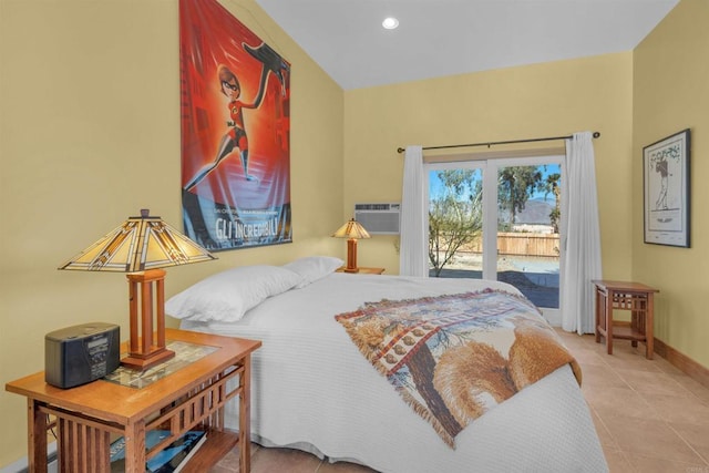 tiled bedroom with a wall mounted air conditioner and access to outside