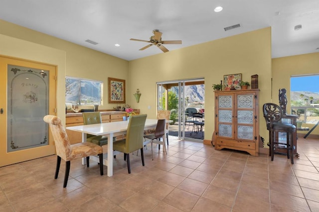 dining area featuring ceiling fan and light tile patterned floors