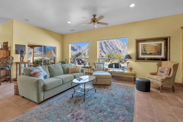 tiled living room featuring a wealth of natural light and ceiling fan