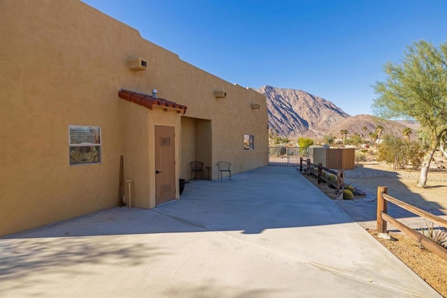 exterior space with a mountain view and a patio