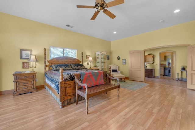 bedroom with ceiling fan and light wood-type flooring