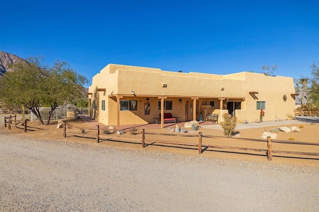 southwest-style home featuring a patio area