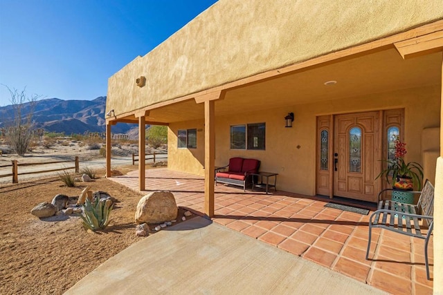 view of patio / terrace featuring a mountain view