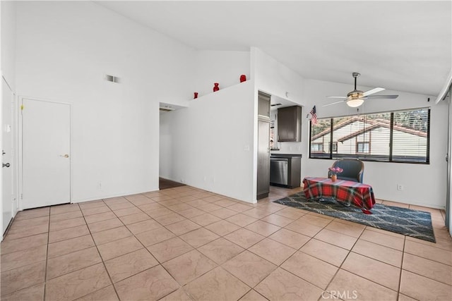 unfurnished living room featuring ceiling fan, light tile patterned floors, and high vaulted ceiling