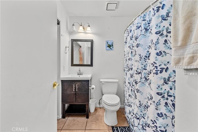 bathroom featuring tile patterned floors, vanity, a shower with shower curtain, and toilet