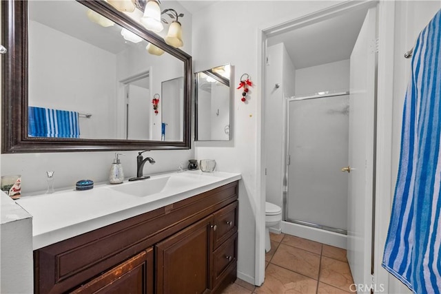 bathroom with vanity, tile patterned floors, toilet, walk in shower, and a notable chandelier