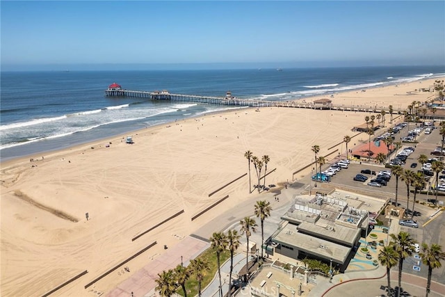 bird's eye view with a water view and a beach view