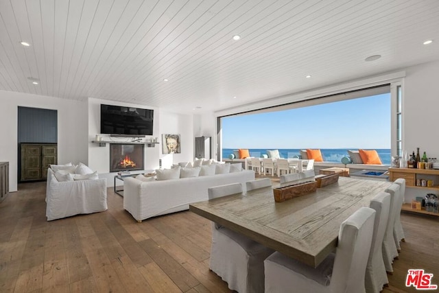 dining area with wood ceiling and hardwood / wood-style flooring