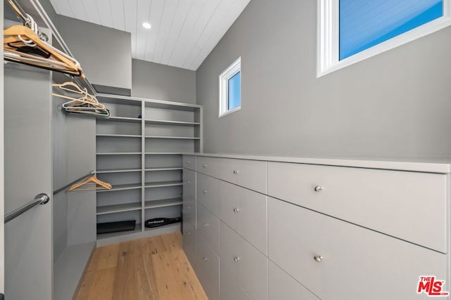 spacious closet with light hardwood / wood-style floors