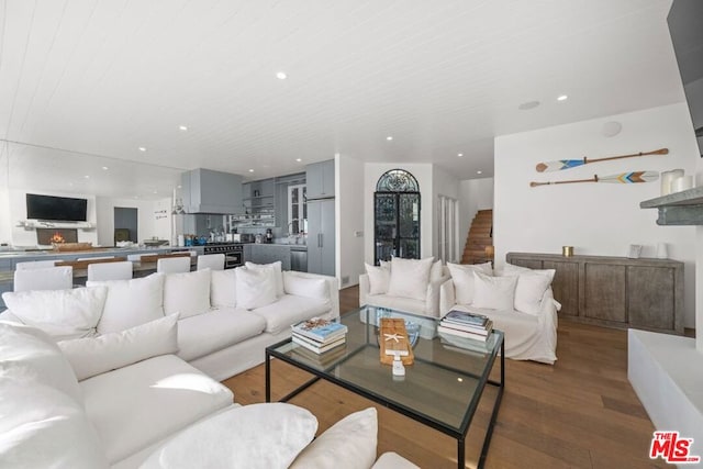 living room with hardwood / wood-style floors and wooden ceiling