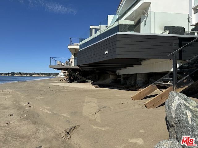 view of side of home featuring a water view