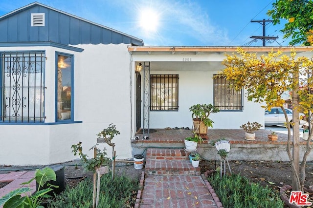 doorway to property with a porch