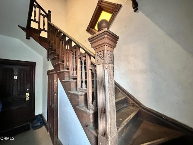 stairs featuring concrete floors