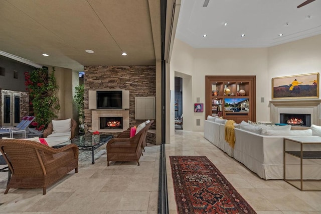 living room featuring a stone fireplace