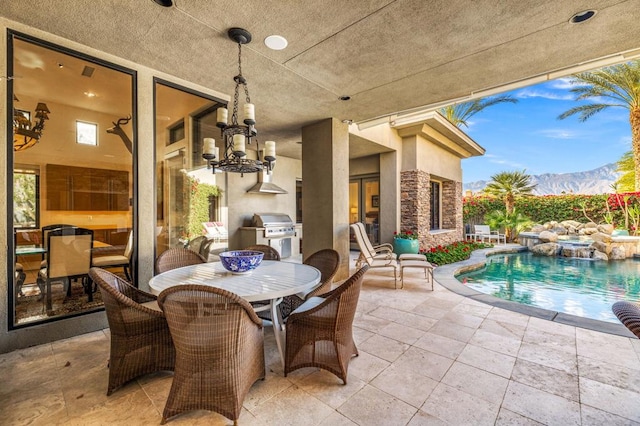 view of patio with a mountain view and grilling area