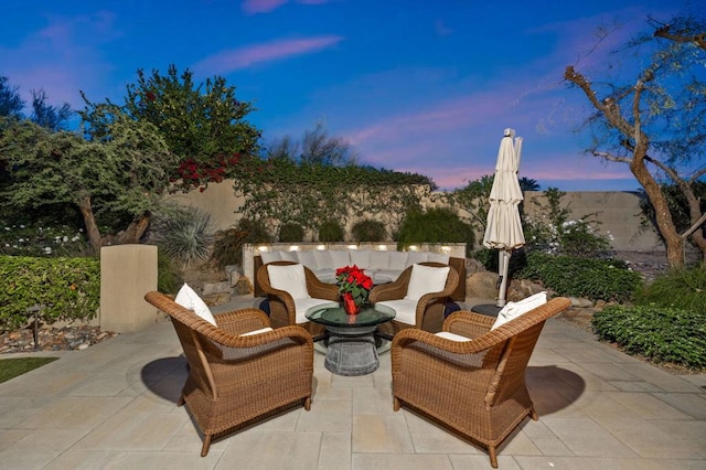 patio terrace at dusk with an outdoor living space