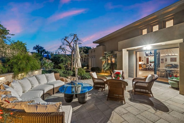 patio terrace at dusk with outdoor lounge area