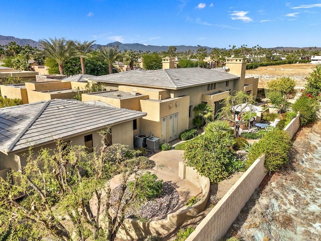 birds eye view of property featuring a mountain view