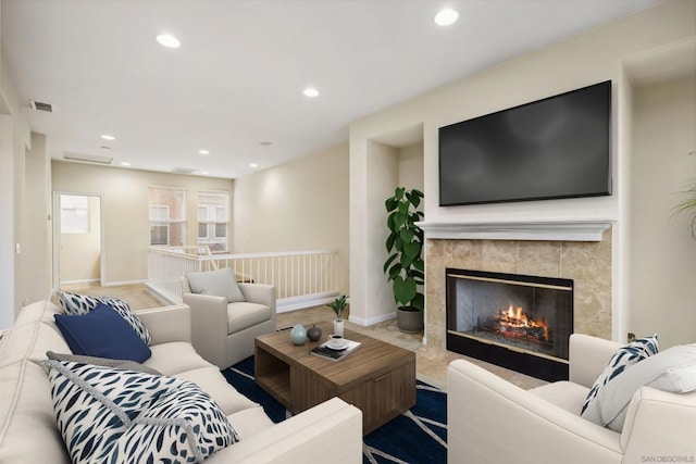 living room with a tiled fireplace