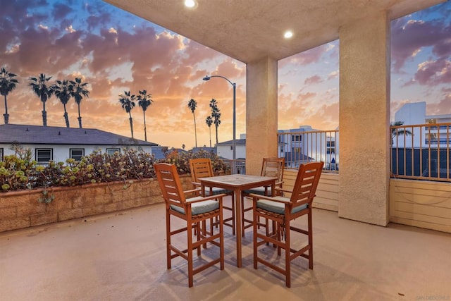 patio terrace at dusk with a balcony