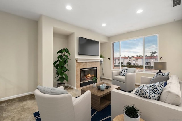 carpeted living room featuring a fireplace