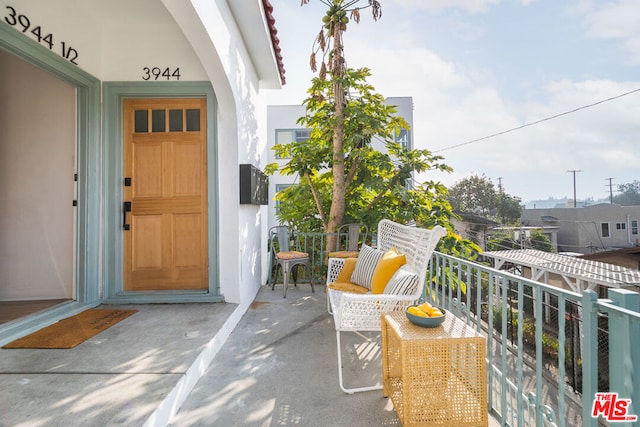 entrance to property with a balcony