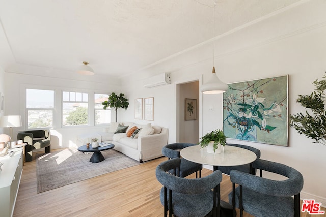 dining room with hardwood / wood-style floors and a wall mounted air conditioner