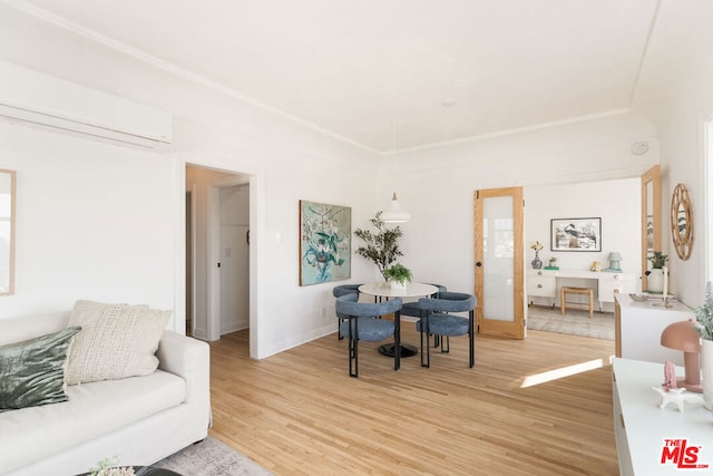 living room with french doors, wood-type flooring, and an AC wall unit