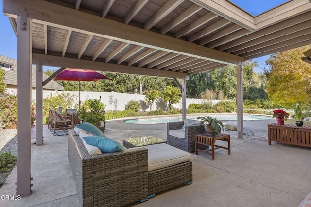 view of patio / terrace with a fenced in pool and an outdoor hangout area