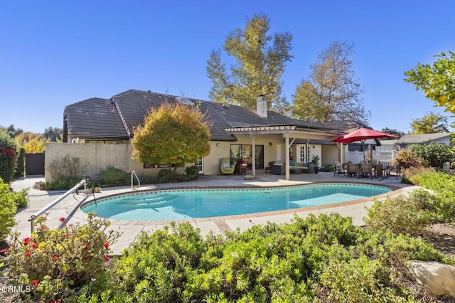 view of swimming pool with a patio