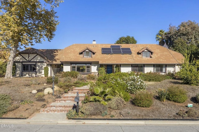 view of front of home with solar panels