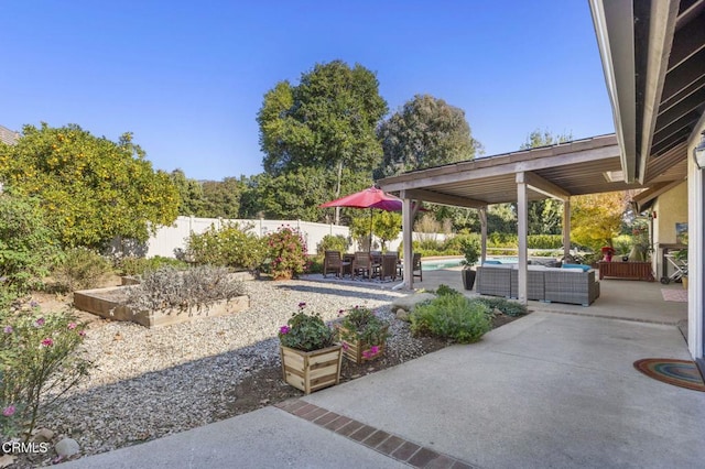 view of patio / terrace featuring an outdoor living space and a fenced in pool