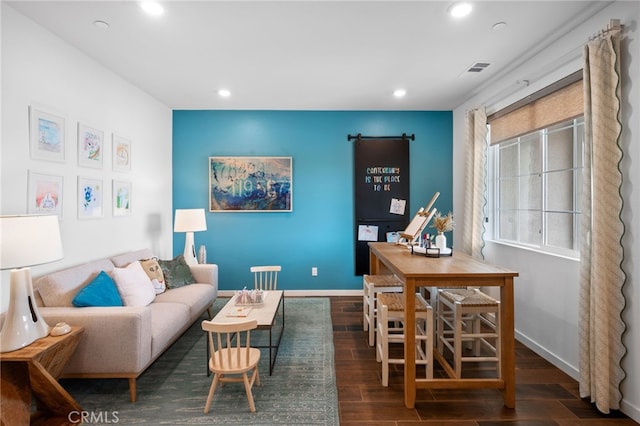 living room with dark hardwood / wood-style flooring