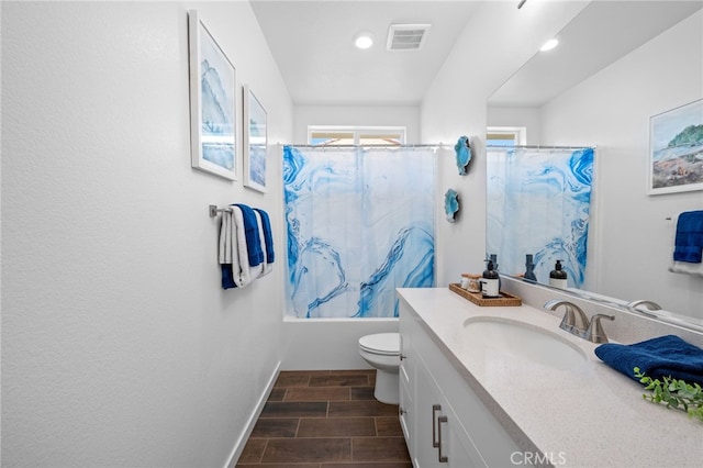 full bathroom with vanity, hardwood / wood-style flooring, toilet, and shower / bathtub combination with curtain