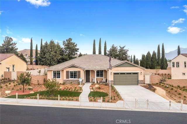 view of front of house with a mountain view and a garage