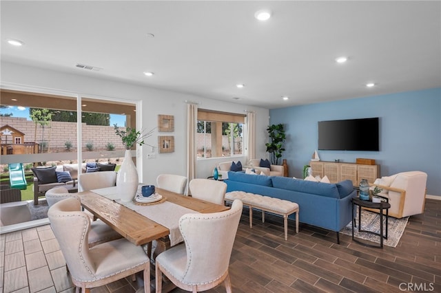 dining area with dark hardwood / wood-style flooring