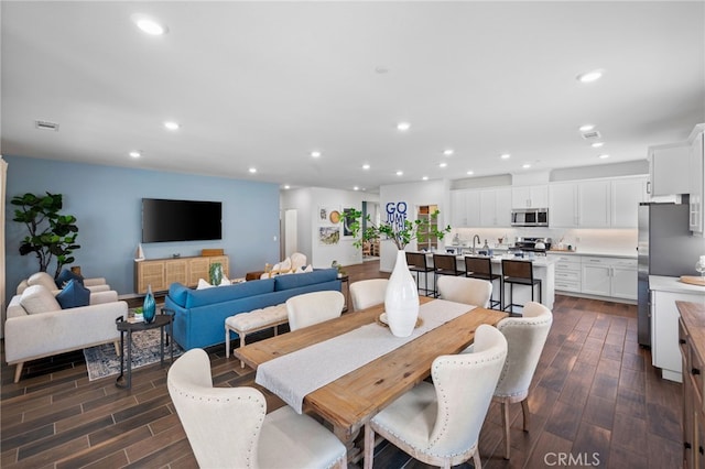 dining area with dark wood-type flooring