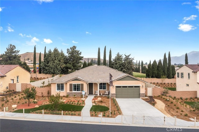 view of front of house featuring a mountain view and a garage