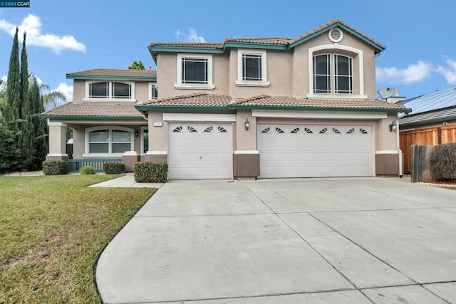 view of front facade with a garage and a front lawn