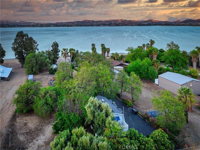 aerial view at dusk with a water and mountain view