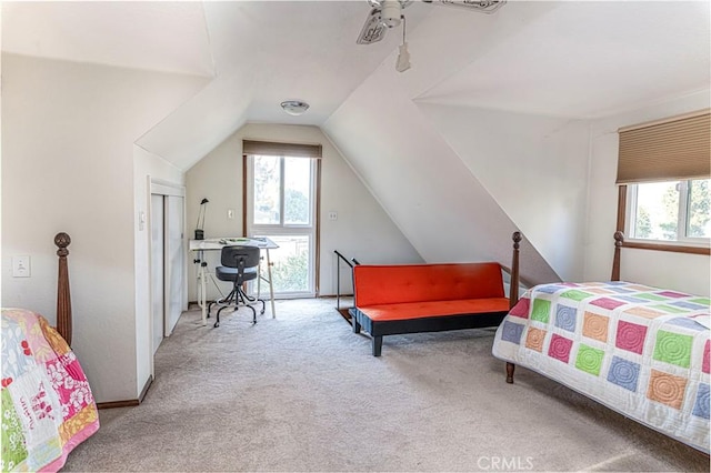 carpeted bedroom featuring ceiling fan and lofted ceiling