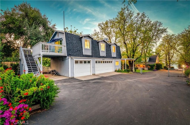 view of front of house with a garage and a wooden deck