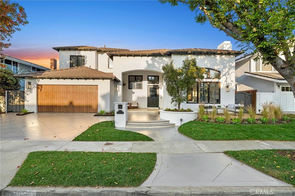 mediterranean / spanish home with a garage