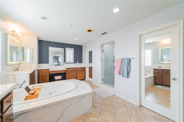 5185 Highview St, Chino Hills, CA 91709 - full bathroom with a whirlpool tub, a stall shower, two vanities, tile patterned floors, and recessed lighting