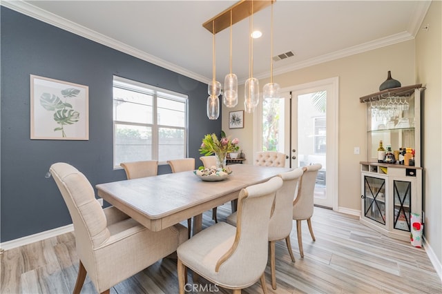 5185 Highview St, Chino Hills, CA 91709 - dining room featuring light wood-style flooring, crown molding, french doors, and a chandelier