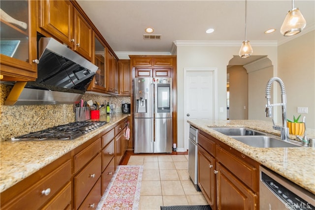 5185 Highview St, Chino Hills, CA 91709 - kitchen with stainless steel appliances, range hood, tasteful backsplash, hanging light fixtures, and ornamental molding