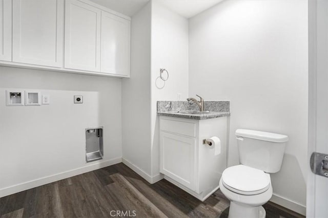 bathroom with vanity, hardwood / wood-style floors, and toilet