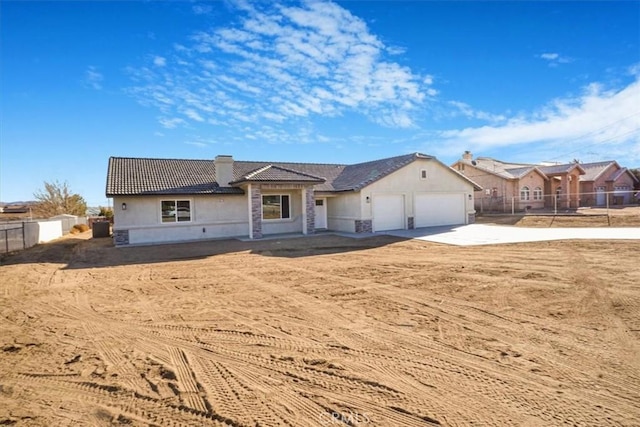 single story home featuring a garage